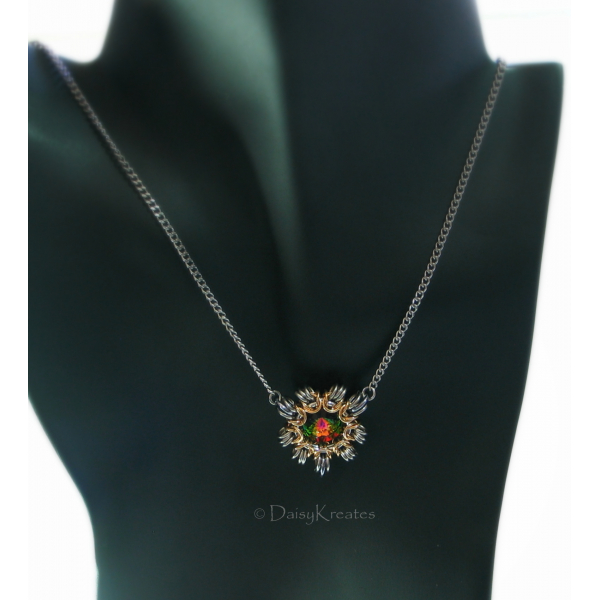 Sun burst motif with steampunk flair, sits front center under collarbone