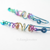 Organic stretch of coils offers unique play of shapes for these lively earrings