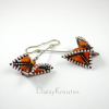 Beaded Monarch butterfly earrings in 3D geometric style Beaded Monarch butterfly earrings in 3D geometric style