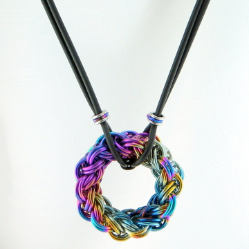 Circular chainmaille pendant in kinged/doubled Vipera Berus weave